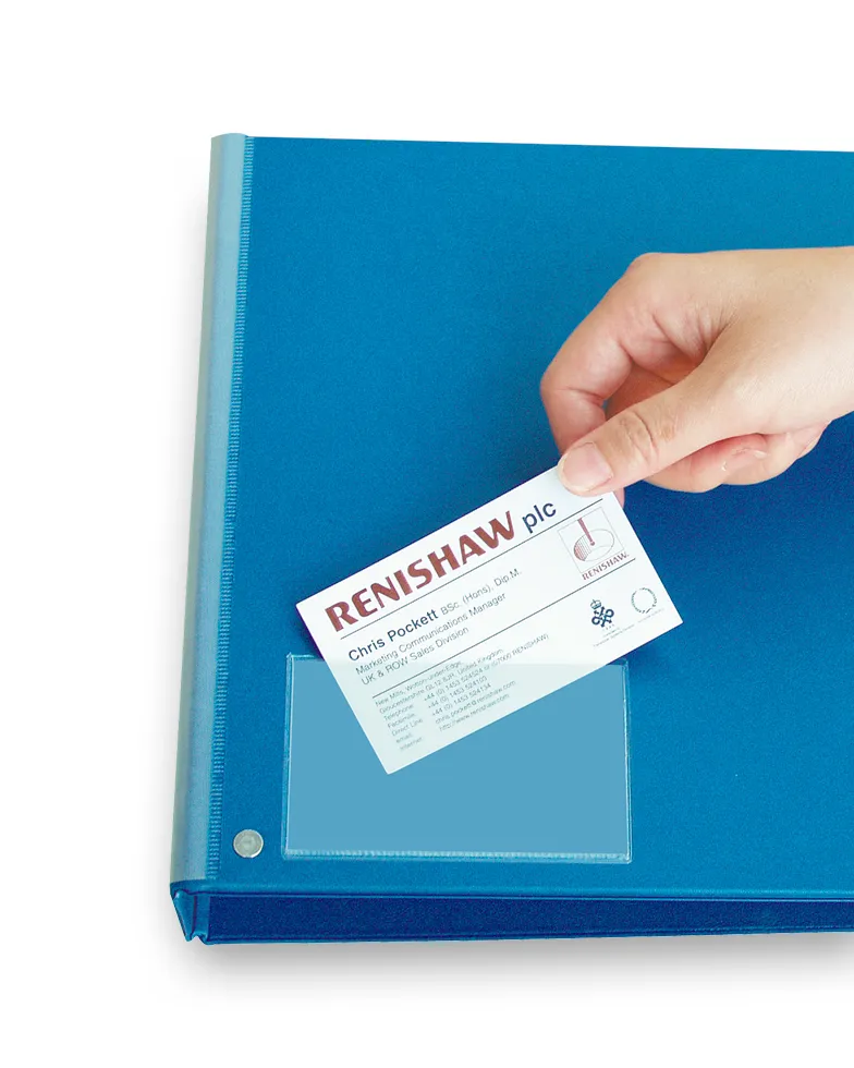 Self-adhesive Business Card Pocket 2 Hand inserting a business card into a self-adhesive business card pocket attached to a binder for easy storage and display.